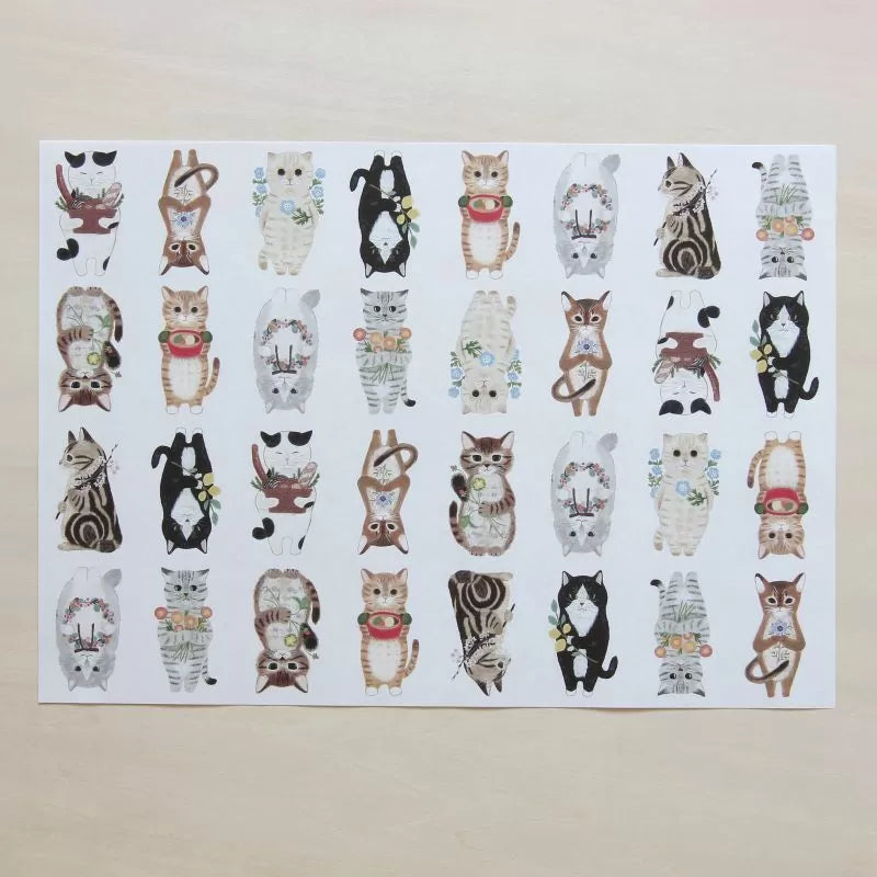 Featuring charming watercolor of different cats from Japanese illustrator 4legs.
This A4 sized paper set includes 20 sheets of paper with the same design featuring over 12 different cat drawings. Perfect to use as wrapping paper, making small bags, or using it as a book cover.
Contents: 20 sheets
Size: A4 size (210×297mm)
Paper type/thickness: About the thickness of copy paper