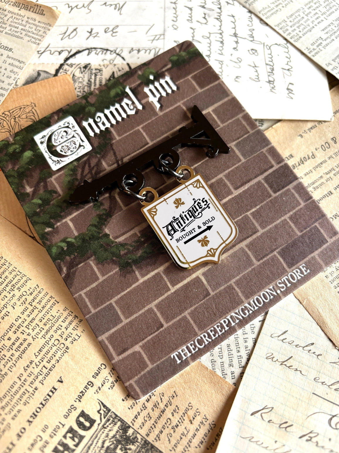 The Creeping Moon - Antique Shop Sign Enamel Pin