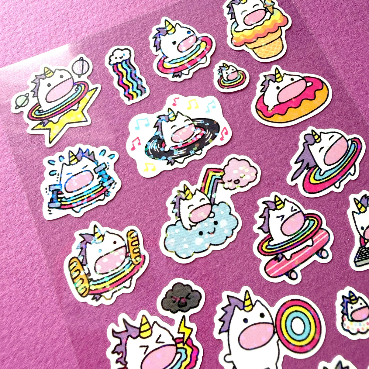 This is part of a new series of sticker sheets that feature different "days".
There are 24 individual stickers on the sheet full of dessert cuteness.
They are vinyl stickers on a clear plastic sheet with a backing card and packaging that's ready to display.
The whole packaging is 3.8 x 8.75" and is ready to hang. The sticker sheet is 3.75 x 5.8"
