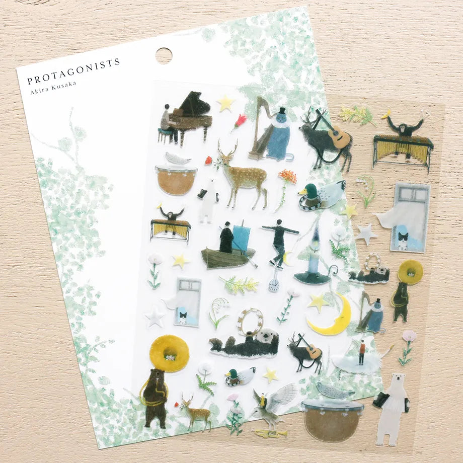 Stickers of illustrator Akira Kusaka. This sticker sheet is packed with beautiful drawings of animals playing instruments, perfect for any music lover.
Printed on PET material, the stickers have a smooth, durable finish that’s easy to peel and place - great for both everyday use and special projects.
✨ Product Details
Smooth, durable PET sticker material
Perfect for planners, journals, scrapbooking, and cardmaking
Backing Sheet Size: 141 × 188 mm
Sticker sheet size: 138 × 170 mm