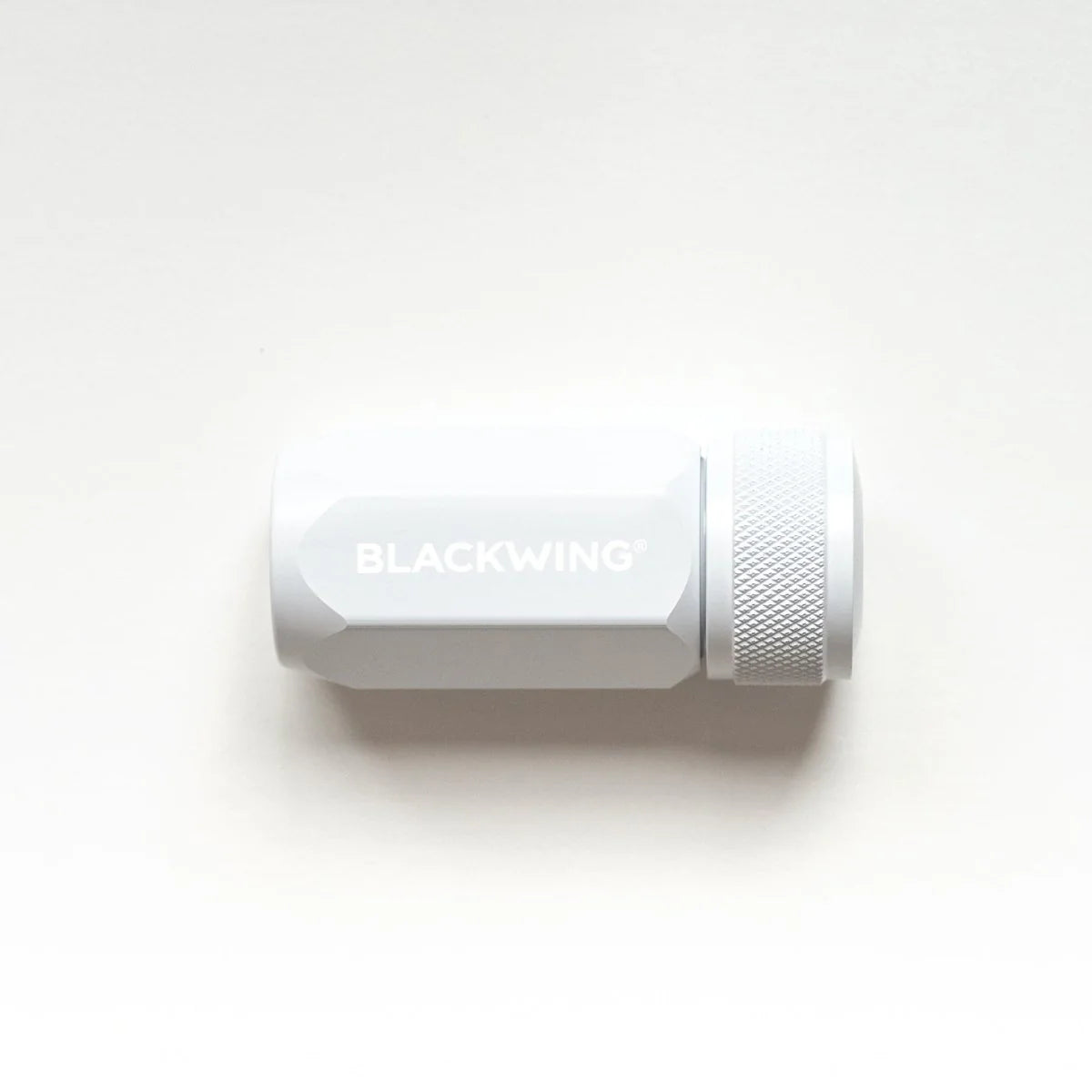 The Blackwing One-Step Long Point Sharpener creates a long, curved pencil point that resists breakage. Its convenient compact design is small enough to fit in the palm of your hand or as a permanent part of your everyday carry. This sharpener is available in black, grey, and white.