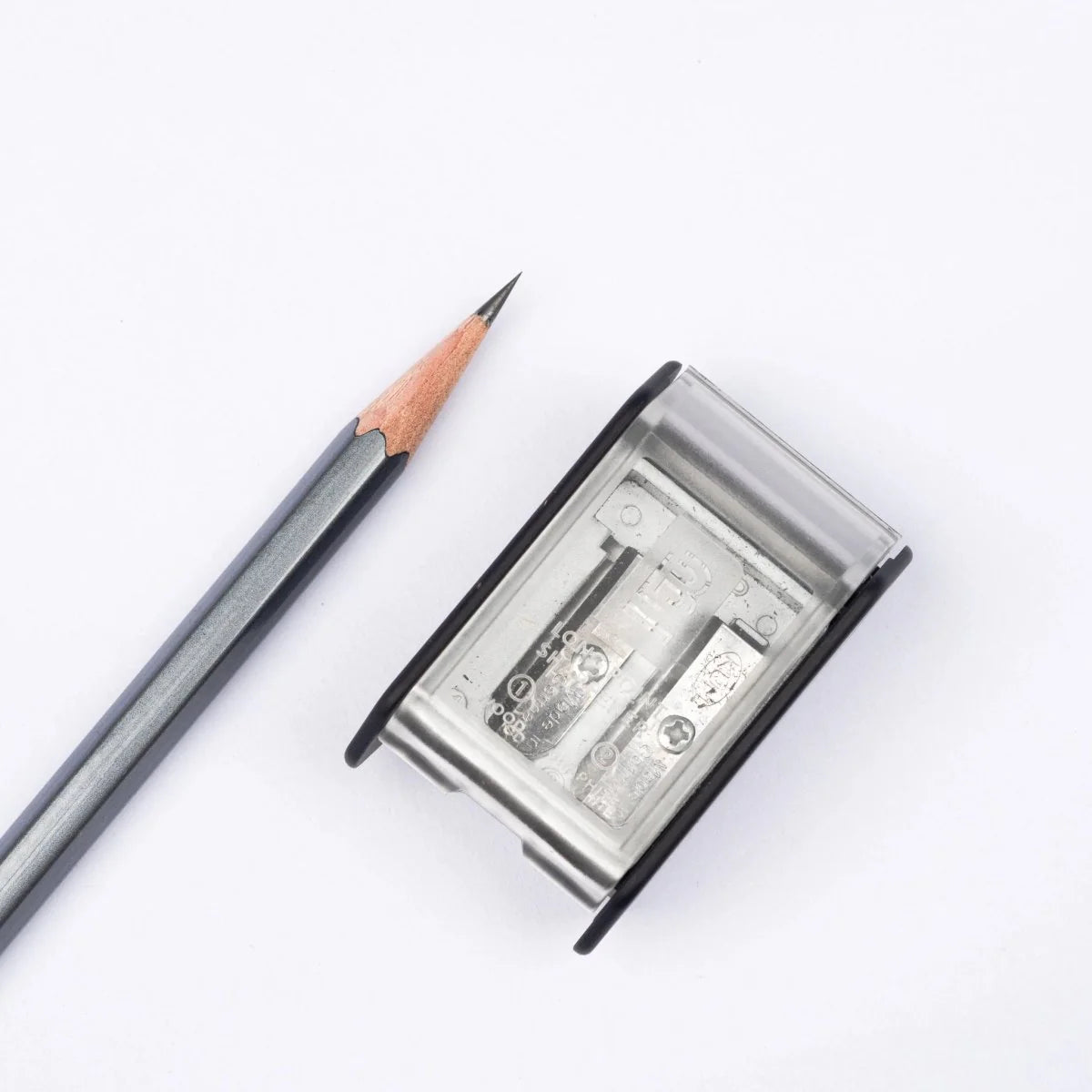 The Blackwing Two-Step Long Point Sharpener creates a sturdy pencil point using a two-step sharpening process. The first hole sharpens the wood, and the second hole precisely sharpens the graphite core, resulting in a strong, sharp point that resists breakage.