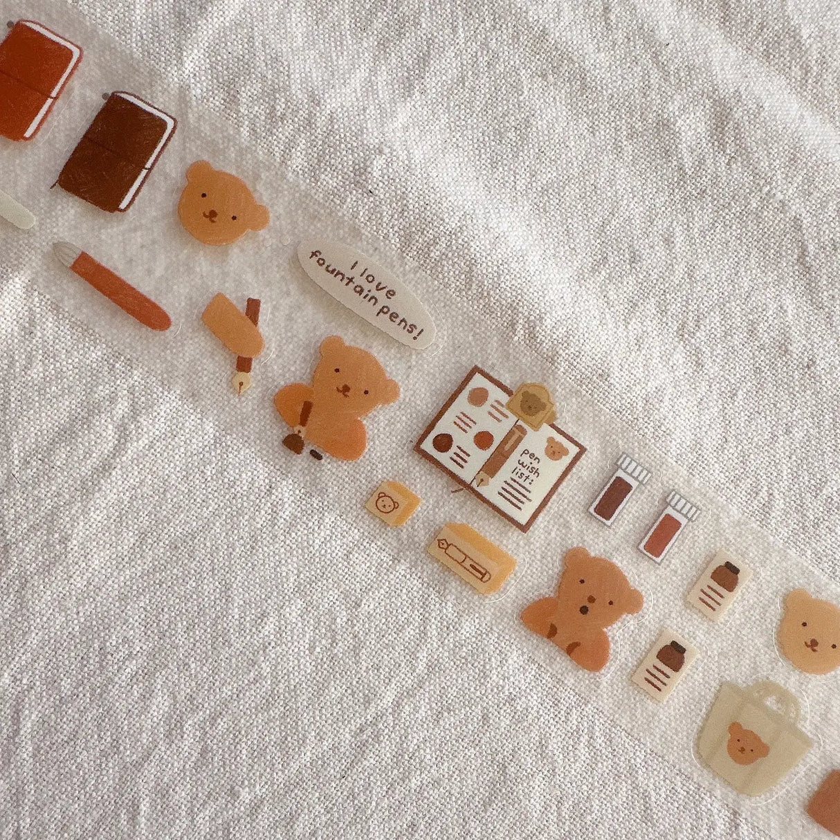 Bear loves attending journaling events with friends. He likes sharing his spreads, stickers, and fountain pens!
Made with:
- clear matte PET Tape
- kiss cut designs
- 40mm x 5m
Note: Colors on screen may appear slightly different on paper. By purchasing, you have acknowledged reading this disclaimer.