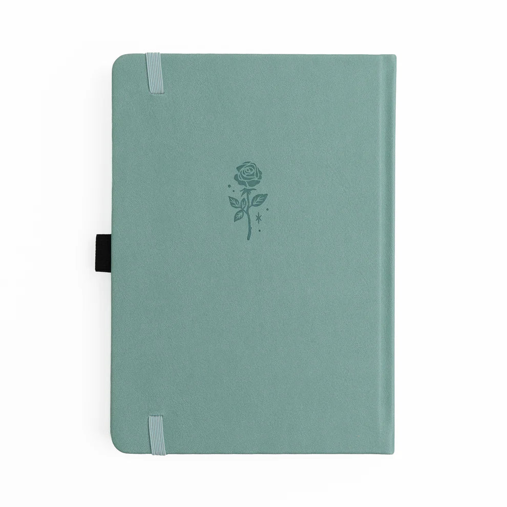 A love letter to book lovers, the Books of Beauty Reading Notebook is designed for cozy reading moments and thoughtful reflection.
Featuring a soft vegan leather cover in a dreamy seafoam hue, delicate gold-foil accents, and an elegant interior end page pattern, this notebook is as beautiful as it is functional—perfect for reading logs, book reviews, TBR lists, and journaling your favorite quotes.
A timeless addition to any stationery or bookish collection—ideal for readers, writers, and journal lovers.