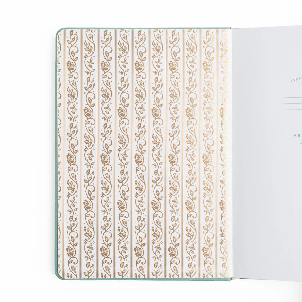A love letter to book lovers, the Books of Beauty Reading Notebook is designed for cozy reading moments and thoughtful reflection.
Featuring a soft vegan leather cover in a dreamy seafoam hue, delicate gold-foil accents, and an elegant interior end page pattern, this notebook is as beautiful as it is functional—perfect for reading logs, book reviews, TBR lists, and journaling your favorite quotes.
A timeless addition to any stationery or bookish collection—ideal for readers, writers, and journal lovers.