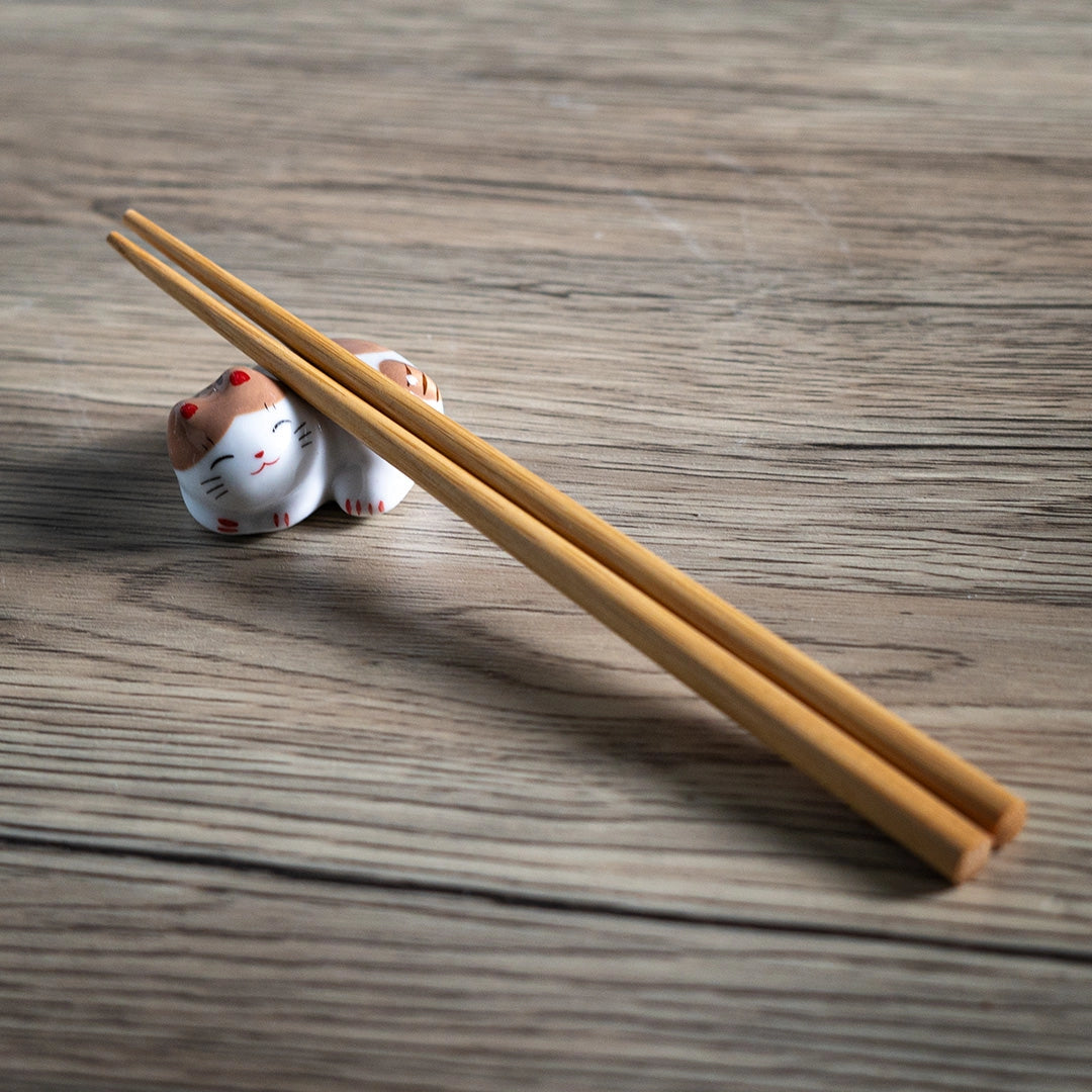 Porcelain brown cat chopstick rest / pen rest.