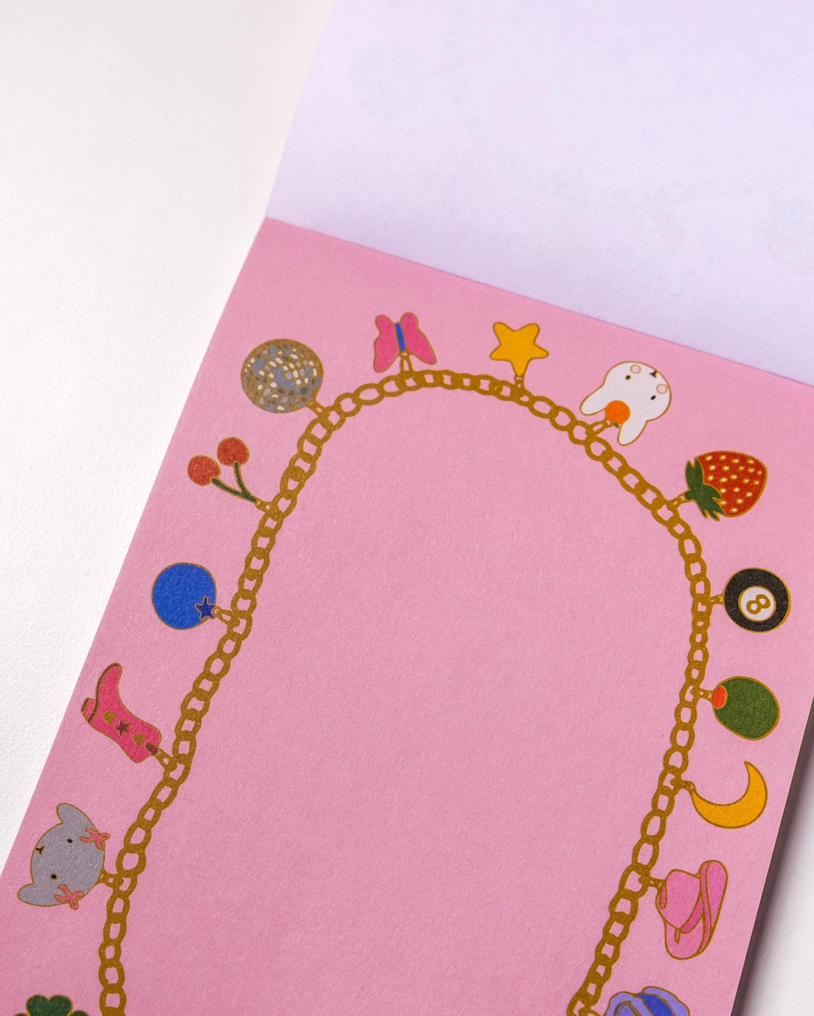 Charmed By Clem Notepad by Clem & Co.
Clem the Bun loves to make charm bracelets for all her friends! However, she kept forgetting which of her friends she had already given them to, so she made a notepad to keep track. Jot down things you don't want to forget either on this charming little notepad!