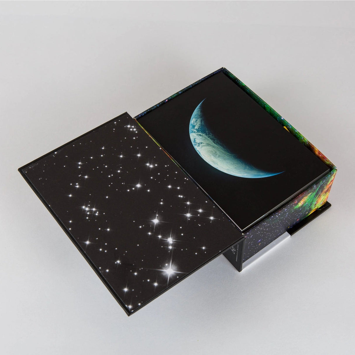 Earth and Space 100 Postcards is a stunning collection of photographs that lets fans of NASA, science, and space exploration share the wonders of the cosmos with friends and family. Each NASA postcard features an astonishing image of Earth from above, the phenomena of our solar system, and the celestial bodies of deep space to create a truly incredible collection that any space fan will cherish. This collection of 100 different NASA postcards will elevate your correspondence with interstellar splendor.