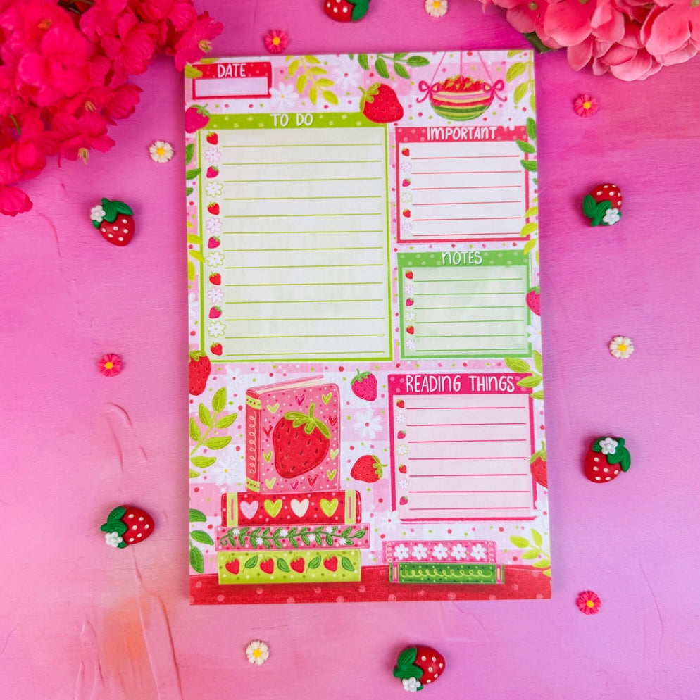 Stay organized in style with this adorable Strawberry Book Stack Daily Planner Notepad! Perfect for jotting down your daily tasks, goals, and bookish ideas, this notepads brings a pop of personality to your desk. Featuring a sturdy cardboard back and premium 70lb. uncoated paper, it's built to last through all your planning adventures.
✦ DETAILS ✦
Size: 5.5" x 8.5"
70 lb. Paper Uncoated
Padded With Cardboard Back
50 Sheets
No magnet backing