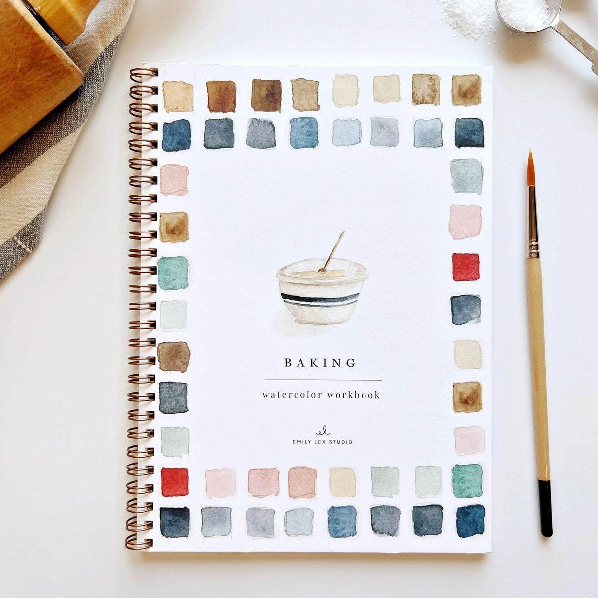 Emily Lex Studio Watercolor Workbook - Baking
Twelve baking illustrations — a cupcake, layer cake, mixing bowl, lattice pie, tray of cookies, rolling pin with cookie cutters, and more — each pre-outlined with step-by-step instructions. Paintings take about thirty minutes from start to finish, making it approachable for first-time painters and a favorite for gifting.
12 beginner-friendly illustrations
Thick 120lb watercolor paper
Lay-flat pages with spiral binding for hassle-free painting and easy te
