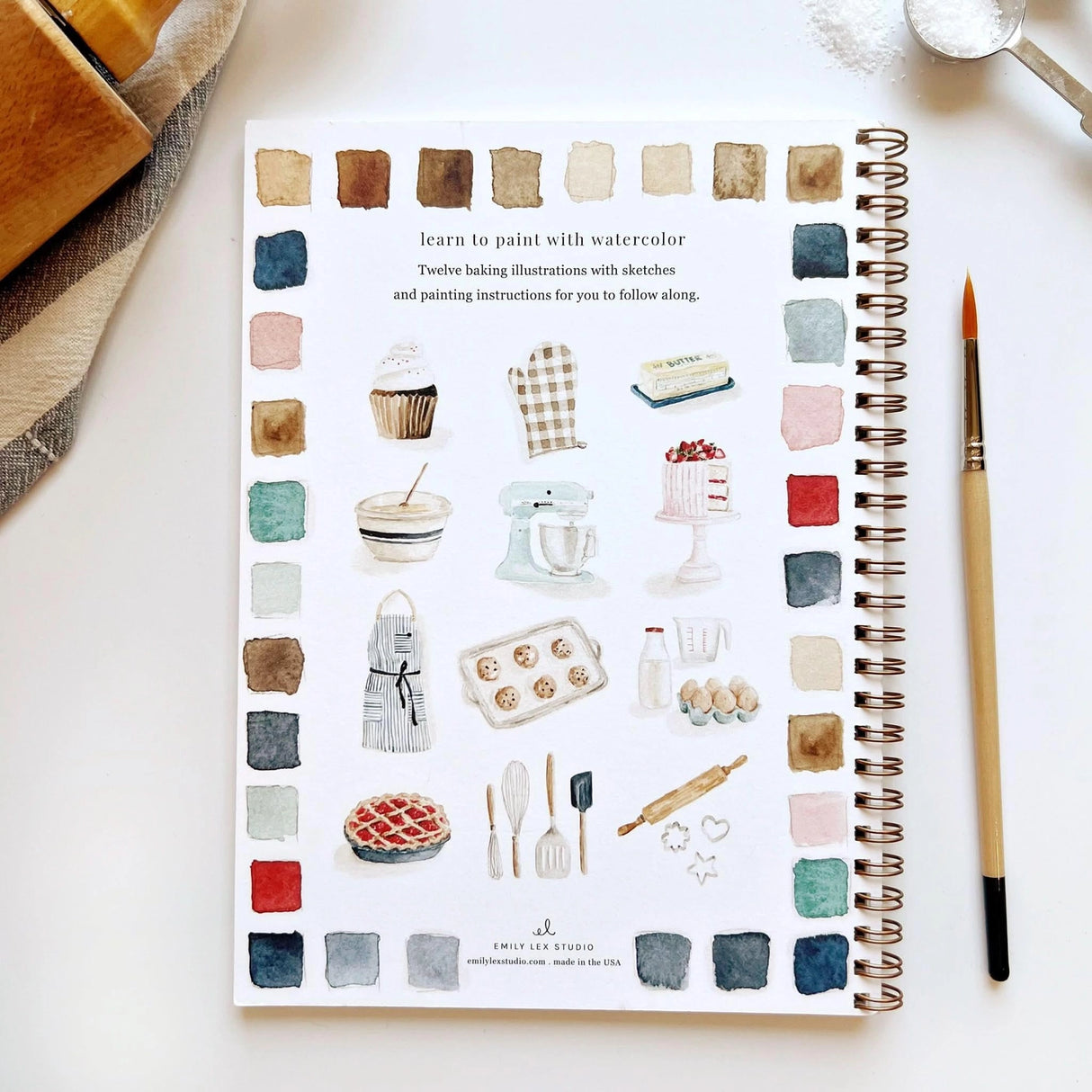 Emily Lex Studio Watercolor Workbook - Baking
Twelve baking illustrations — a cupcake, layer cake, mixing bowl, lattice pie, tray of cookies, rolling pin with cookie cutters, and more — each pre-outlined with step-by-step instructions. Paintings take about thirty minutes from start to finish, making it approachable for first-time painters and a favorite for gifting.
12 beginner-friendly illustrations
Thick 120lb watercolor paper
Lay-flat pages with spiral binding for hassle-free painting and easy te