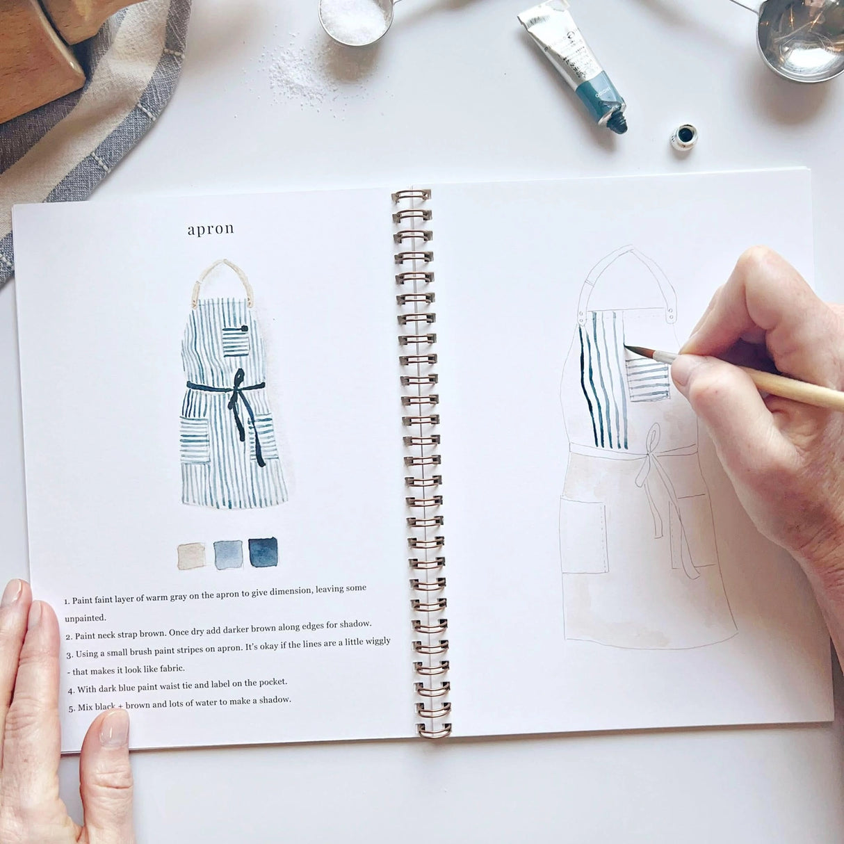 Emily Lex Studio Watercolor Workbook - Baking
Twelve baking illustrations — a cupcake, layer cake, mixing bowl, lattice pie, tray of cookies, rolling pin with cookie cutters, and more — each pre-outlined with step-by-step instructions. Paintings take about thirty minutes from start to finish, making it approachable for first-time painters and a favorite for gifting.
12 beginner-friendly illustrations
Thick 120lb watercolor paper
Lay-flat pages with spiral binding for hassle-free painting and easy te