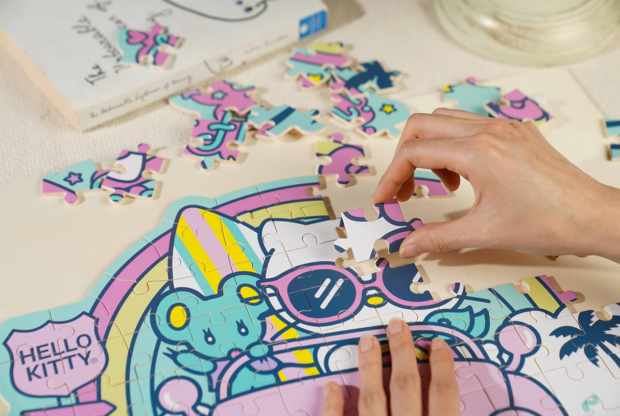 Meet our officially licensed Sanrio product: Hello Kitty Wooden Jigsaw Puzzle (89pcs) – Kawaii Edition. Crafted from high-quality wood, this 89-piece puzzle features adorable Hello Kitty poses amidst vibrant Kawaii patterns. Perfect for fans of all ages 8+, it offers a joyful puzzle-solving experience. Ideal as a gift or a delightful pastime, embrace the Kawaii spirit with this charming Hello Kitty puzzle. Order now and enjoy the cuteness in every piece!