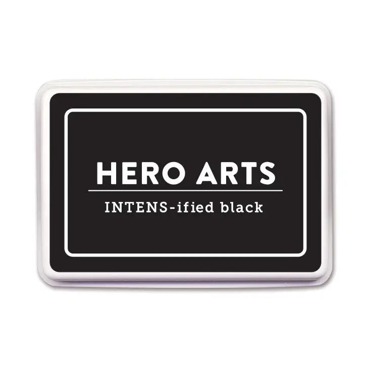 Hero Arts Intens-ified Black ink pad is a perfect choice for everyday stamping and crafting. The raised pad, measuring 3.5" x 2.25", easily inks stamps of any size.
The hybrid (both dye and pigment) formulation is ideal for use with alcohol-based markers. The intense black ink is acid-free, archival, and fade-resistant.