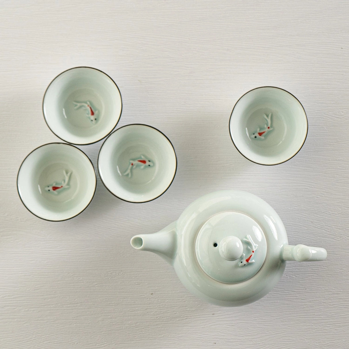 Japanese Koi Fish Kung Fu Tea Set 8oz Tea Pot with 4 Cups Blue
Capacity: 8 fl oz
Teapot comes with spout strainer
Material: Porcelain
Origin: China