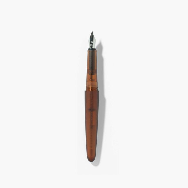 A pen that evokes the texture of frosted glass. Its translucency reveals the internal mechanism as an aesthetic feature. Careful consideration of form and colour palette ensures an elegant presence, even when not in use.
The pen is equipped with thoughtful functionality, including an extended grip section and a screw cap designed for quick access with minimal turns. The visible ink level allows for easy refills.
Available in a Fine and Medium nib
Includes converter
Steel nib