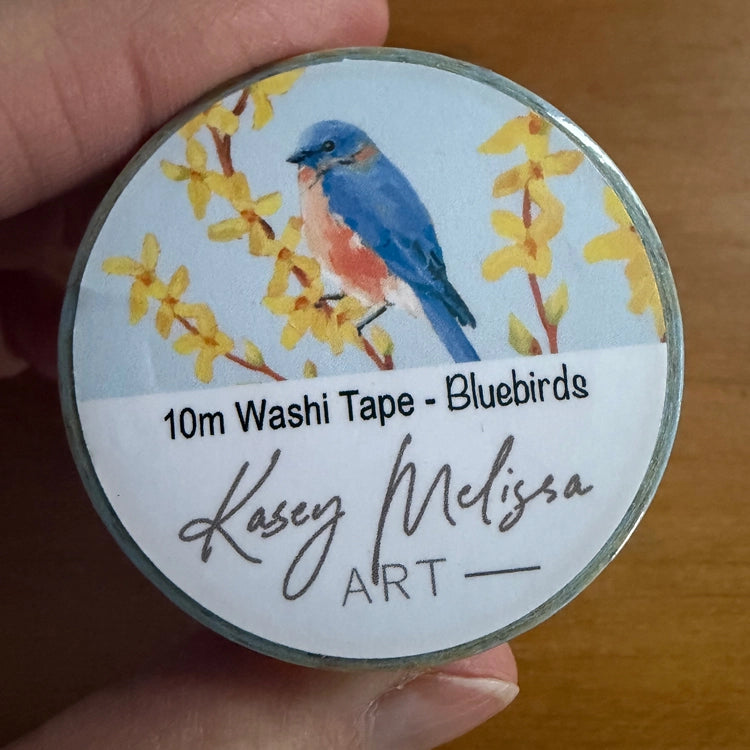 Bluebird and forsythia flower washi tape. Add a bit of color to your journal, letters or scrapbooking.
- 1 inch wide
- 10 Meters long
- designed by Kasey
Images and art copyright Kasey Melissa Art