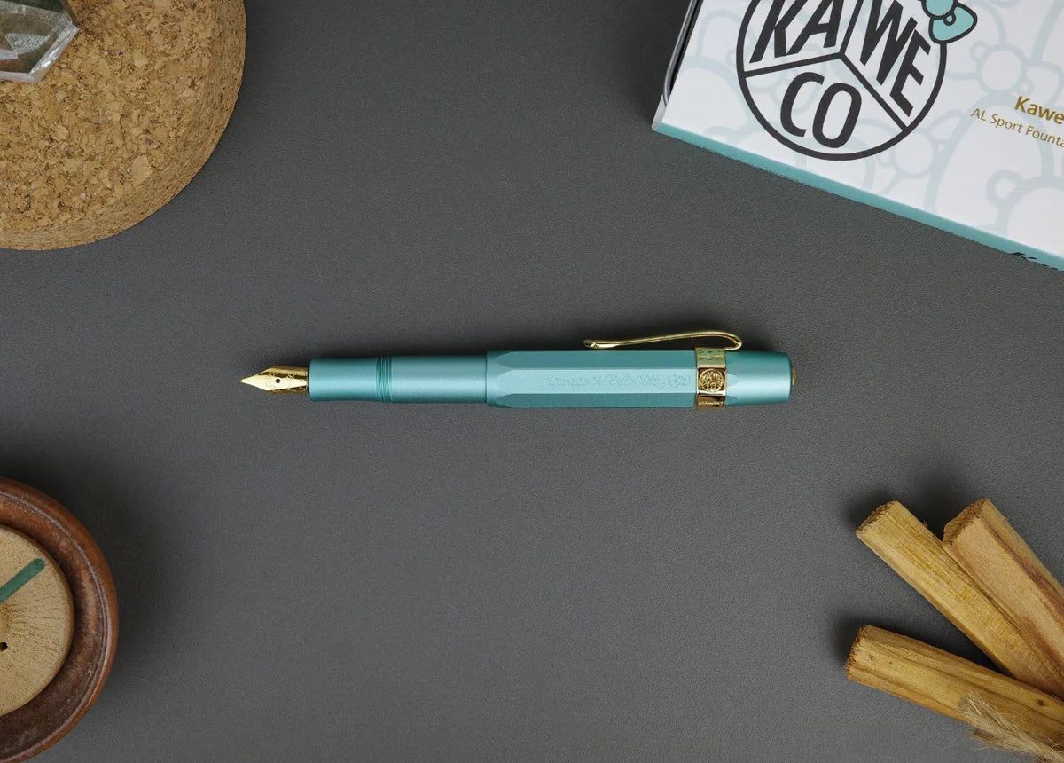 Limited Edition Kaweco x Hello Kitty AL Sport Fountain Pen - Opal with Gold Trimmings
Hello Kitty meets Kaweco again to bring you the Limited Edition Kaweco AL Sport Fountain Pen. The aluminum body and cap are shaded in a unique Opal color. The cap features a Kaweco x Hello Kitty branding, and the gold-plated nib is engraved with Hello Kitty's adorable face.