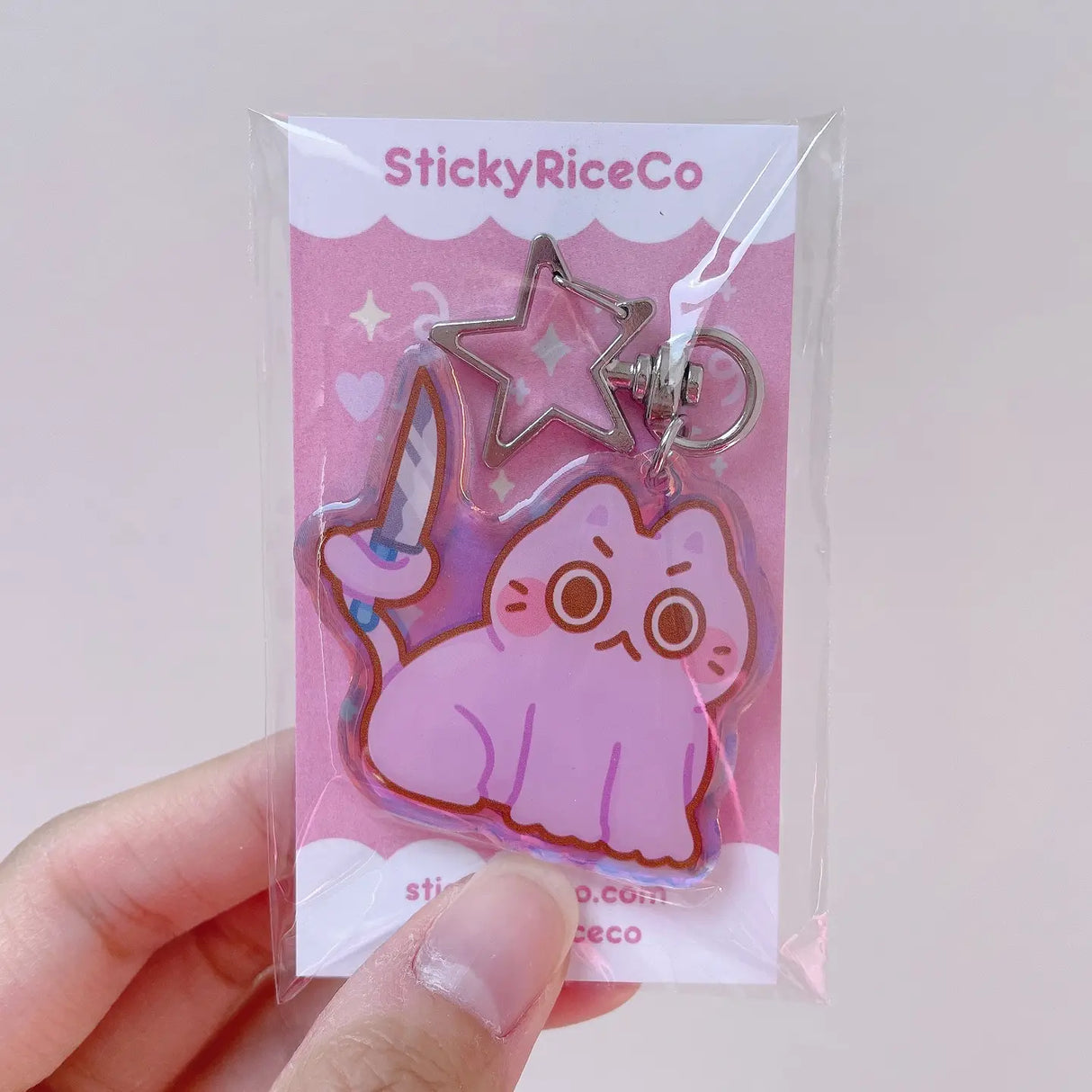 This angry but cute knife cat keychain is the perfect accessory to your phone, purse, backpack, etc!
PLEASE NOTE: There may be plastic film covers on the backs of the keychains. The film is there to protect the keychains in transit and may look scratched. They can be removed to show shine/clarity on the surface.
Details:
2" in wide
ONE SIDED glitter epoxy with flat back
Double sided printing on sturdy acrylic
Colors may differ from picture due to lighting differences
Mad