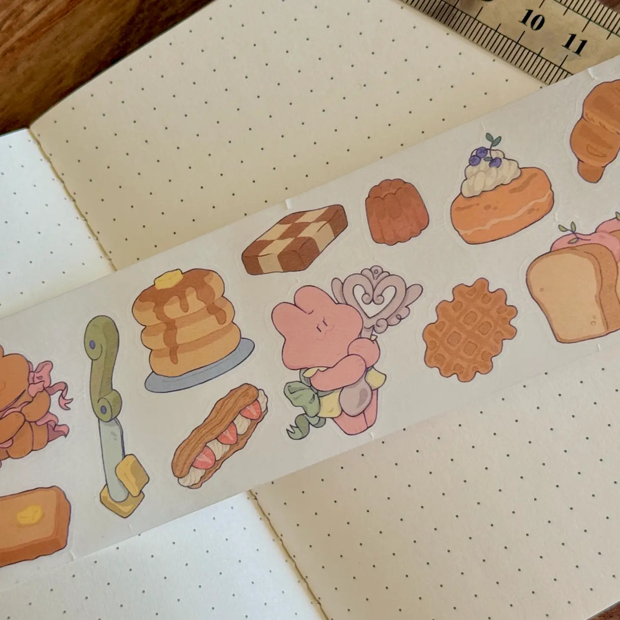 5 meters of pure kiss-cut, washi sticker bakery bliss~
They readjust easily and blend in with the paper. (Lighter paper recommended for maximum visibility)
Just like the washi tape material you love, but in a sticker roll. No more saving your stickers for later! Use it up!!
Dimensions: 50mm x 5m