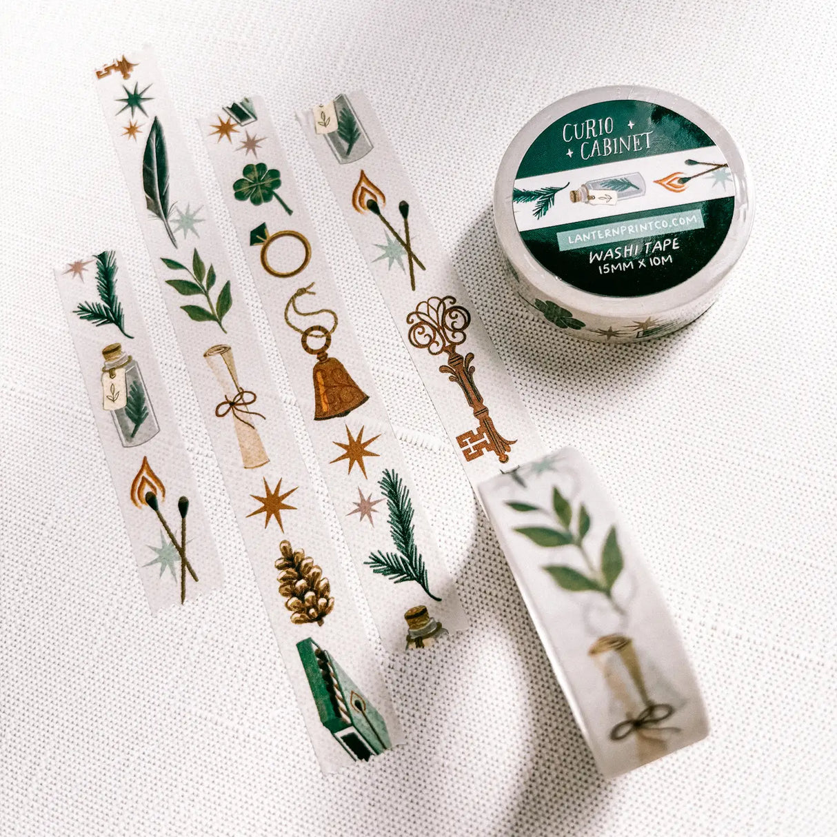 Removable Washi craft tape for journaling and gift wrapping; featuring curios, specimens, and trinkets on an off-white background.
15mm x 10m
Shrink wrap packaging with label