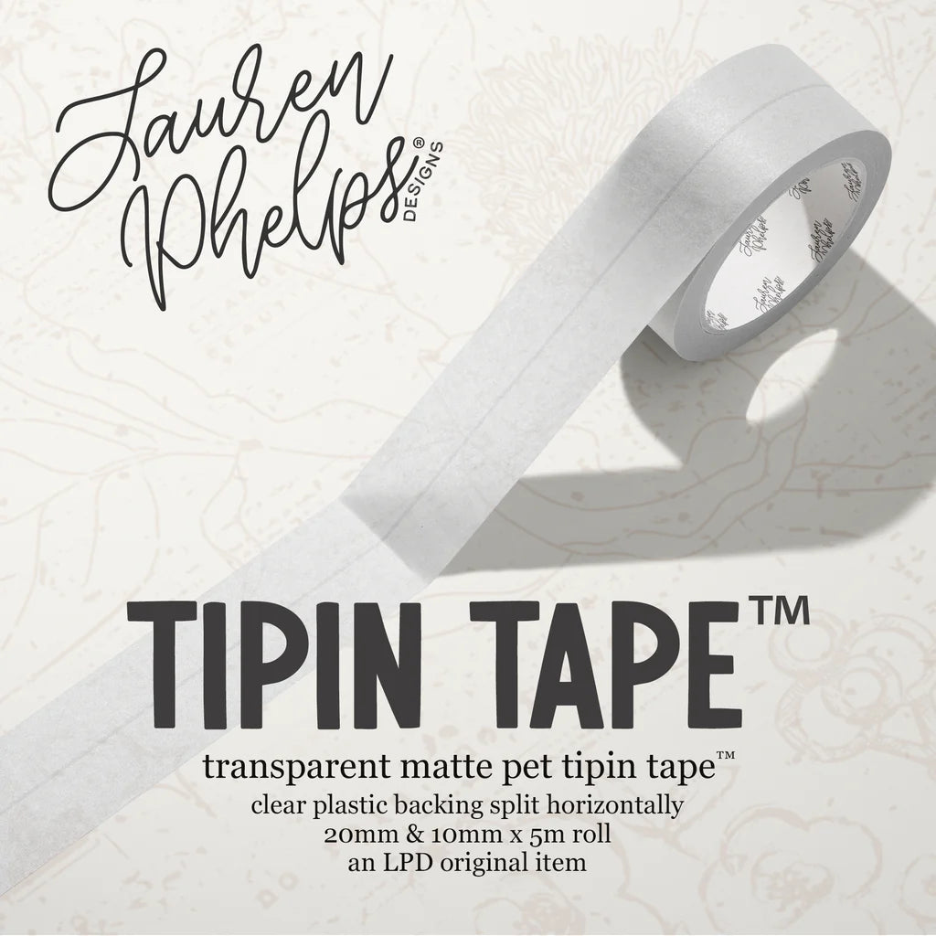 Do you love adding interactive elements to your scrapbook layouts like photos, journaling cards, patterned paper, ephemera, and keepsakes, but want a clean, professional way to attach them without bulky adhesives or visible hinges?
Tip In Tape™ was designed for exactly that.
Tip In Tape™ is a clear matte PET tape created for adding interactive elements to scrapbook pages and paper crafting projects with precision and ease. It allows you to create flip-ups, tip-ins, layered details, and movable elements wh