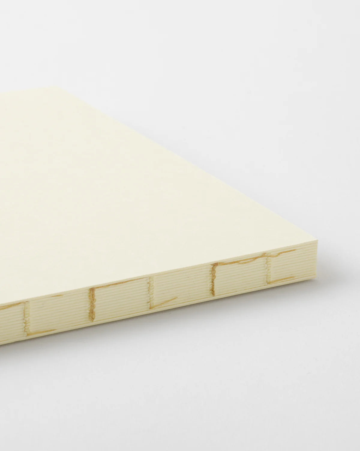 Side profile of the MD Notebook Thick A5 Square highlighting its extra‑thick page block.