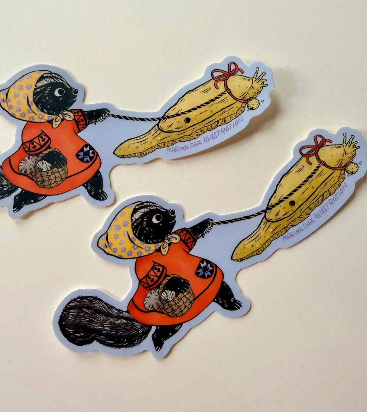 This Skunk and Slug are going for a walk.
This vinyl matte sticker is weather and waterproof-stick it on a notebook, bike, or car- it's going to stick around! Heck, throw it on a water bottle and through the dishwasher. This sticker can go anywhere. Sticker measures 4.74" x 2.75" Printed in USA.