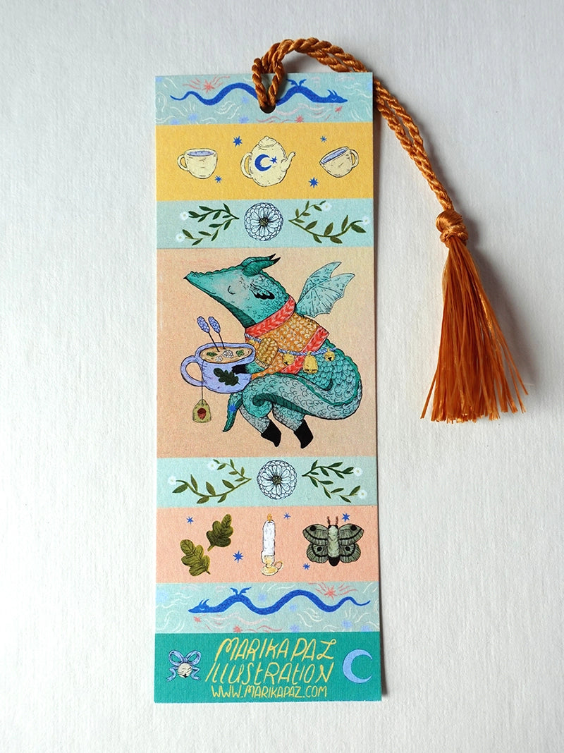 A dragon on an adventure! This dragon is great at keeping your place in your favorite book. Perfect for book lovers! This bookmark has the same image on both sides.
Printed on heavy cardstock and comes with a tassel, these bookmarks measure 2x6 inches.
Printed in USA
