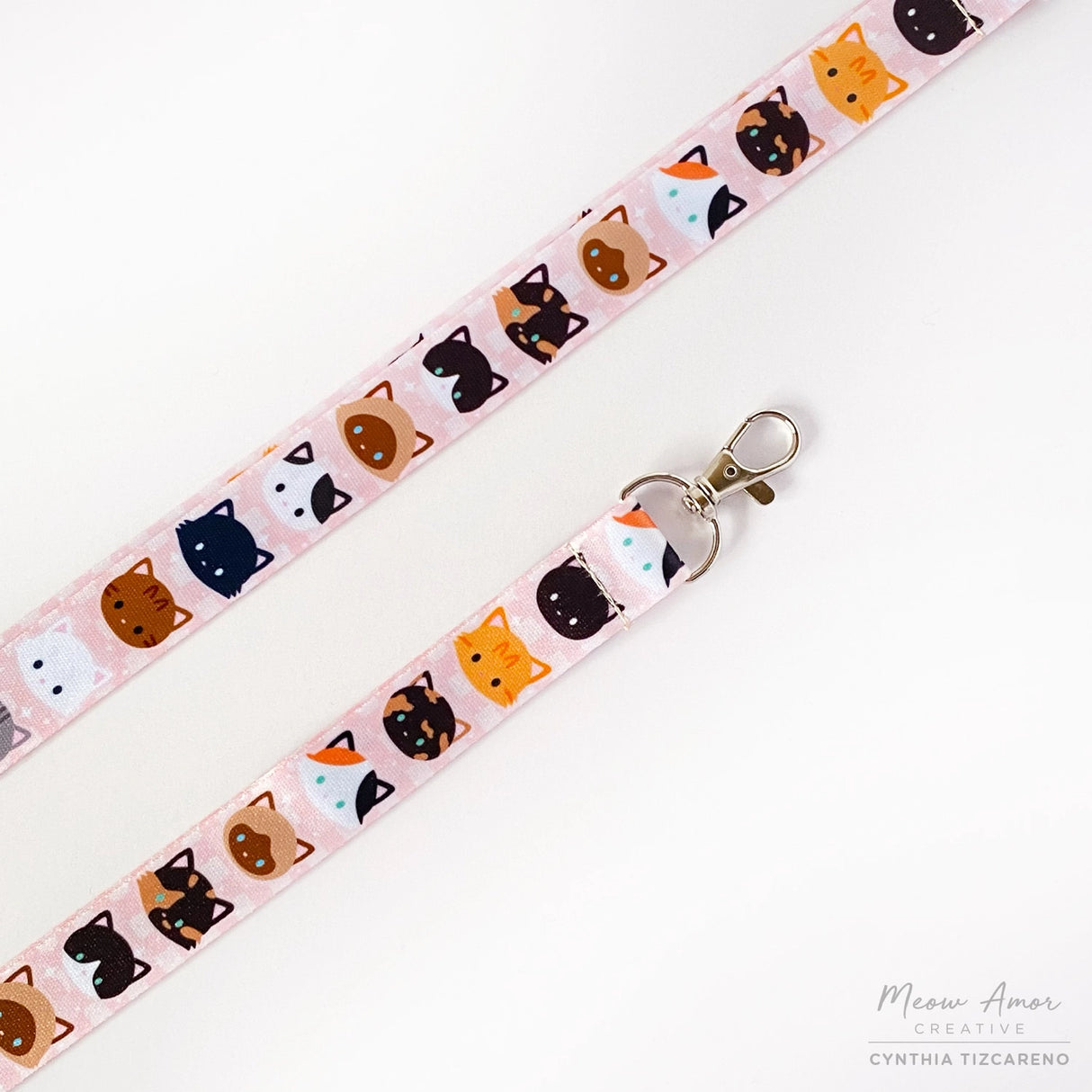 The cute cat pattern showcases a variety of adorable felines and will surely make you stand out. Keep your belongings close and add a touch of cuteness to your daily routine.
2cm X 95cm
double-sided printing
Swiveling Lobster Clasp 