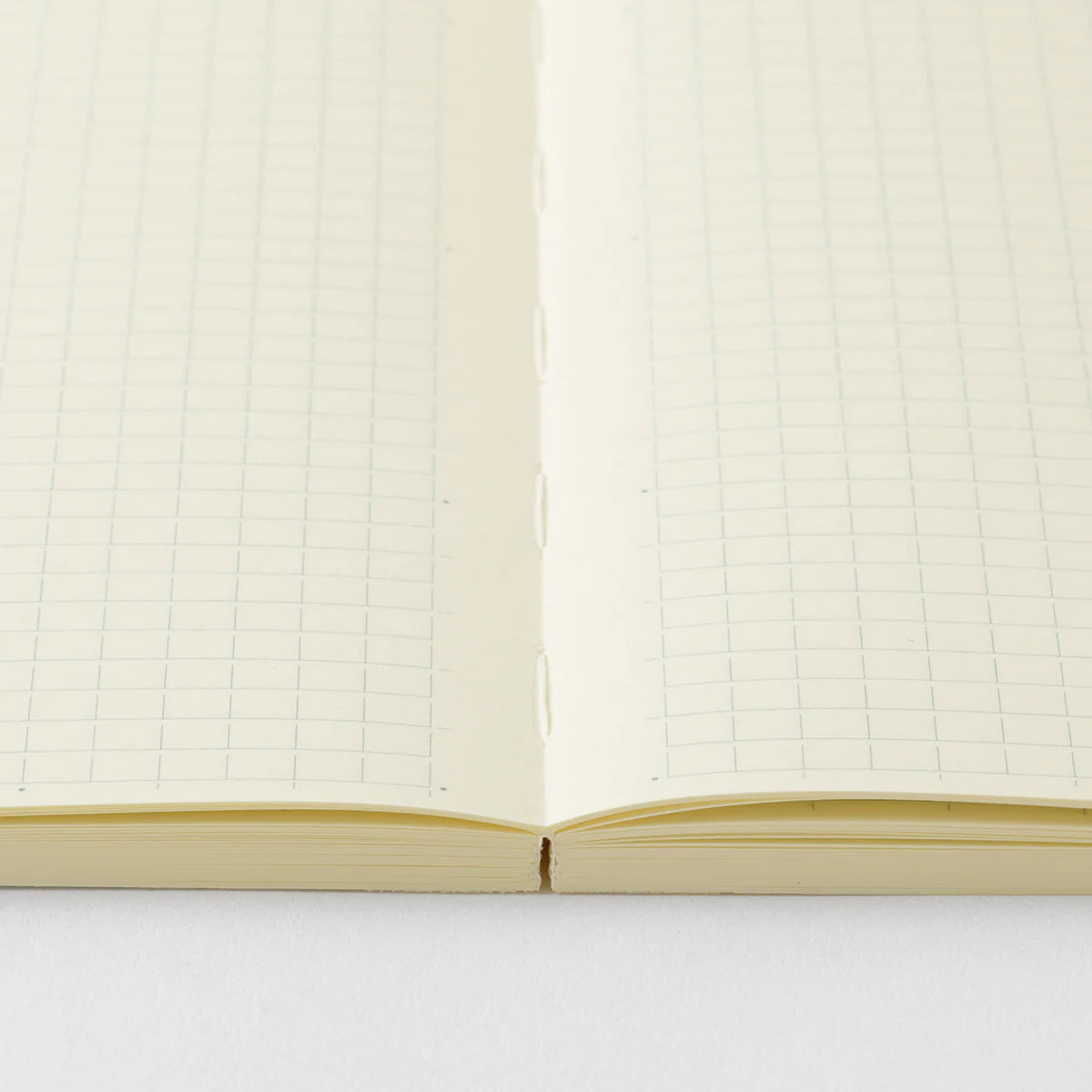 Crafted in Japan, this minimalist notebook is designed to enhance your writing experience. Inside, you'll find the high-quality Midori Diary (MD) paper, first developed in 1960 and refined ever since. Midori has rigorously tested this paper with various writing instruments to ensure quality, checking for ink feathering or bleeding, drying time, the smoothness of pen tips on the surface, and the tactile feel. The result is a paper that resists bleeding and feathering and is fountain-pen friendly, ensuring a