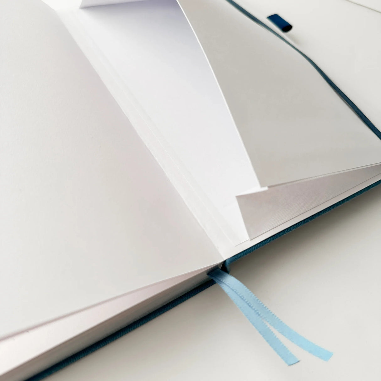 Jiji The Cat Journal in Ocean Blue with Holographic Edges and Logo 🌊✨
Product Details:
Size: A5 (5.70 x 8.26 inches)
160 Dotted Grid Pages (5 x 5 mm)
2 Bookmarks
Elastic Band and Pen Holder
Expandable storage compartment