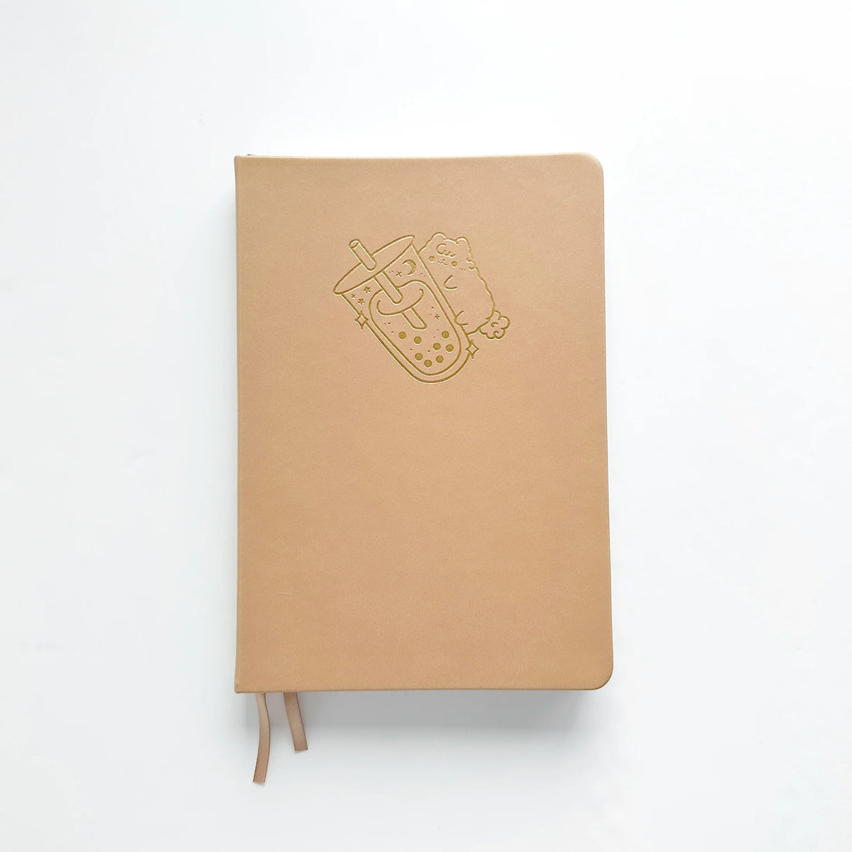 Milk Tea Journal in a beautiful, rich boba colour 🧋 with Gold Foil Logo ✨
Product Details:
Size: A5 (5.70 x 8.26 inches)
160 Dotted Grid Pages (5 x 5 mm)
2 Bookmarks
Elastic Band and Pen Holder
Expandable storage compartment