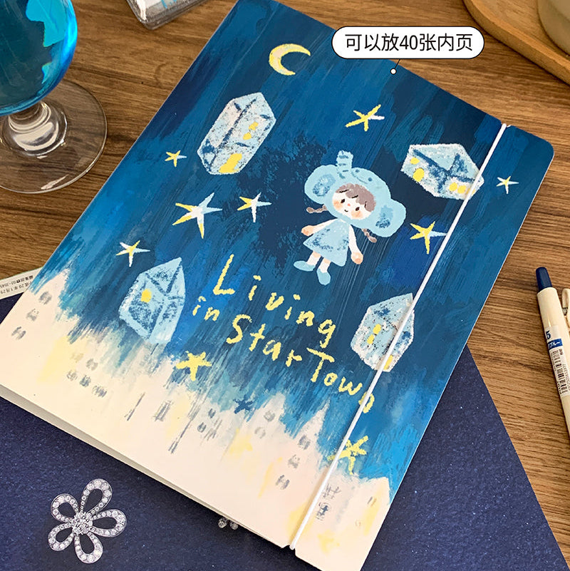 Molinta A5 Organizing Binder - Star Town
Designed in a six‑ring format, this binder is perfect for organizing ephemera, sticker sheets, journaling inserts, and creative plans. This A5 binder, gives you plenty of room to store larger pages, decorative layouts, and all the bits and pieces that make your journaling uniquely yours. Whether you're building sticker albums, creating themed spreads, or keeping your notes tidy, this binder offers a beautiful and functional way to keep everything in one place.