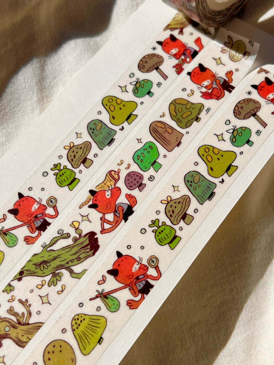 This washi tape features a little fox on their adventures through the mushroomy forest!
This roll is 15mm wide x 10m of paper tape. Washi tape is super durable and flexible. It tears easily and can be safely applied to a variety of surfaces; it doesn’t leave a sticky residue behind, making it especially ideal for stationery and hanging prints temporarily.