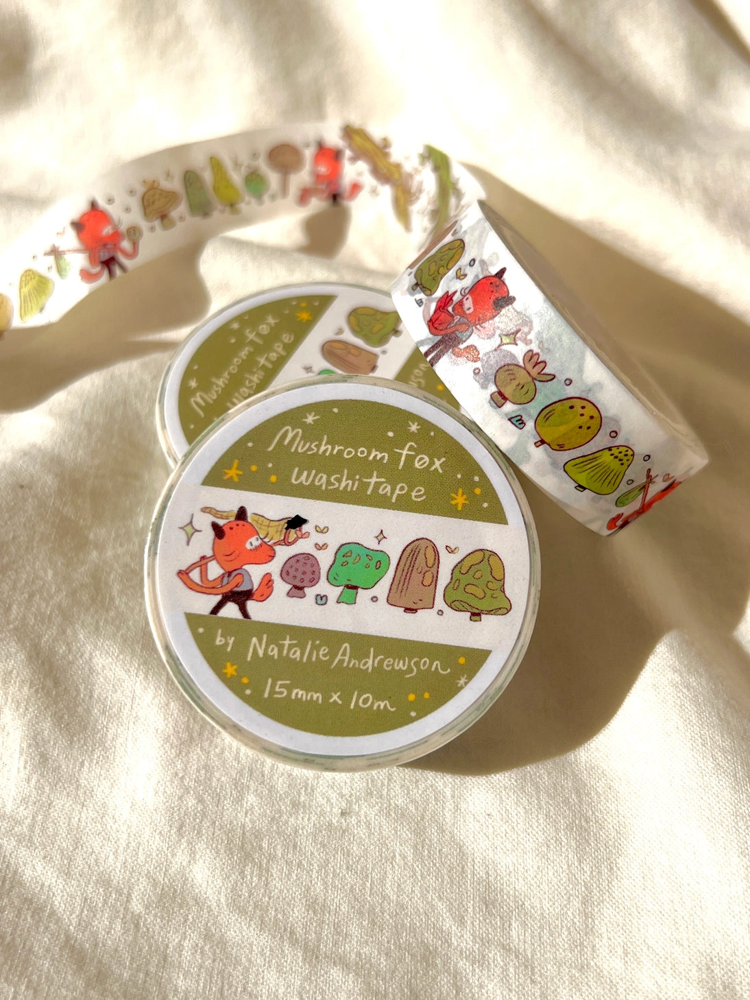 This washi tape features a little fox on their adventures through the mushroomy forest!
This roll is 15mm wide x 10m of paper tape. Washi tape is super durable and flexible. It tears easily and can be safely applied to a variety of surfaces; it doesn’t leave a sticky residue behind, making it especially ideal for stationery and hanging prints temporarily.