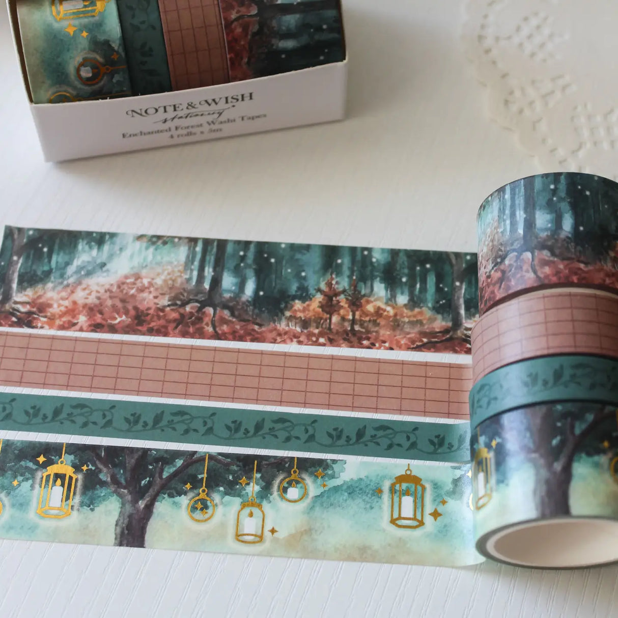 This enchanted forest washi tape gift set is designed for dreamers, storytellers, and stationery lovers who enjoy woodland walks at dusk. Featuring hand-painted watercolour forest scenes by Rebecca. Perfect for journaling and anyone who loves bringing the beauty of the British countryside into their creative projects.
30mm x 5m - Forrest
25mm x 5m with gold foil - Lanterns
5mm x 5m - Foliage
10mm x 5m - grid