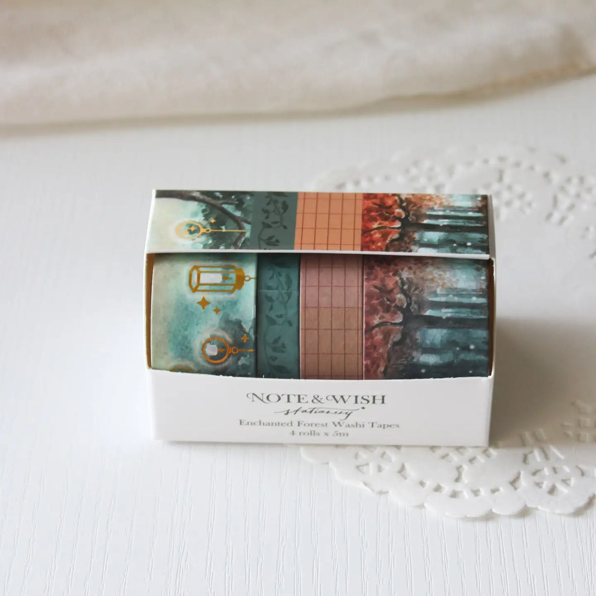 This enchanted forest washi tape gift set is designed for dreamers, storytellers, and stationery lovers who enjoy woodland walks at dusk. Featuring hand-painted watercolour forest scenes by Rebecca. Perfect for journaling and anyone who loves bringing the beauty of the British countryside into their creative projects.
30mm x 5m - Forrest
25mm x 5m with gold foil - Lanterns
5mm x 5m - Foliage
10mm x 5m - grid