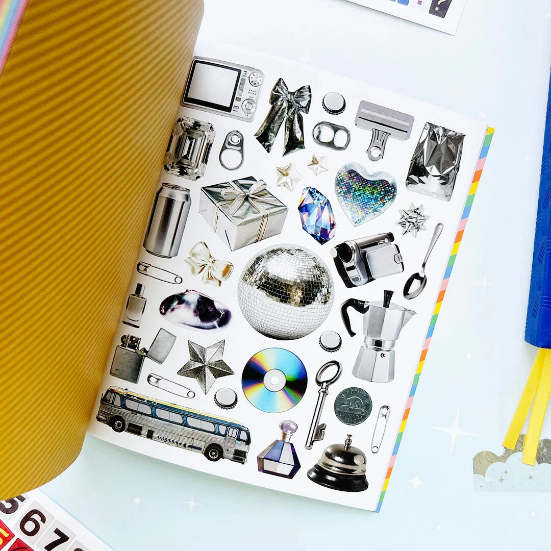Your sticker stash is about to get very color-coordinated 🌈 Sticker the Rainbow Book Vol. 2: In Real Life is packed with 1500+ photorealistic stickers in every shade imaginable, from juicy lemons and shiny silver treasures to butterflies, vintage objects, florals, gems, and colorful everyday finds. With 30 pages of ultra-realistic stickers (plus 4 pages of alphabet + number stickers!), this book is basically a rainbow treasure hunt for your journal, planner, snail mail, laptop, or craft cart.
