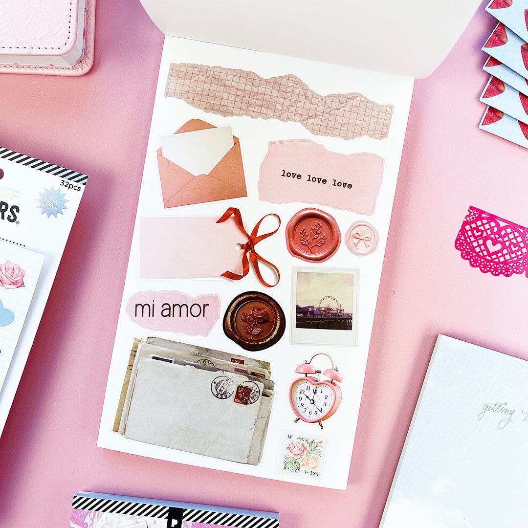 Sweet, nostalgic, and a little bit extra—in the best way. The Coquette Junk Journal Sticker Book is packed with all the pretty details your pages have been waiting for. Think bows, florals, frames, patterns, alphabets, and darling vintage-inspired bits made for layering, collaging, and documenting every little moment.