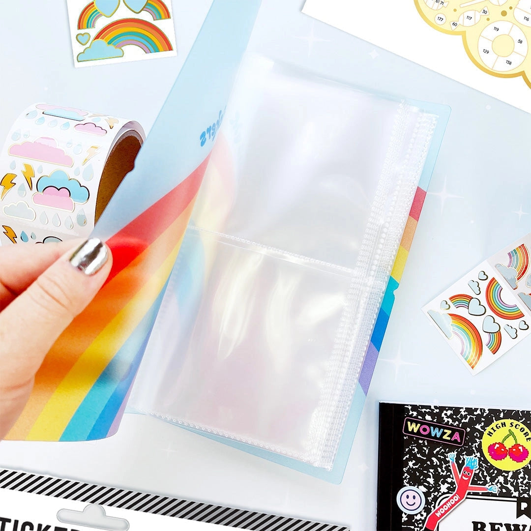 This rainbow-bright Pocket Sticker Keeper is made to stash, sort, and show off your fave sheets. With clear pockets inside and a snug elastic closure, it keeps your collection neat, protected, and ready to grab on the go. Toss it in your tote, bring it to school, or keep it by your desk — your stickers just found their forever spot. 💛
Inside pockets are made to display the 4" x 4" Pipsticker sheets and can hold at least 80 sticker sheets! 