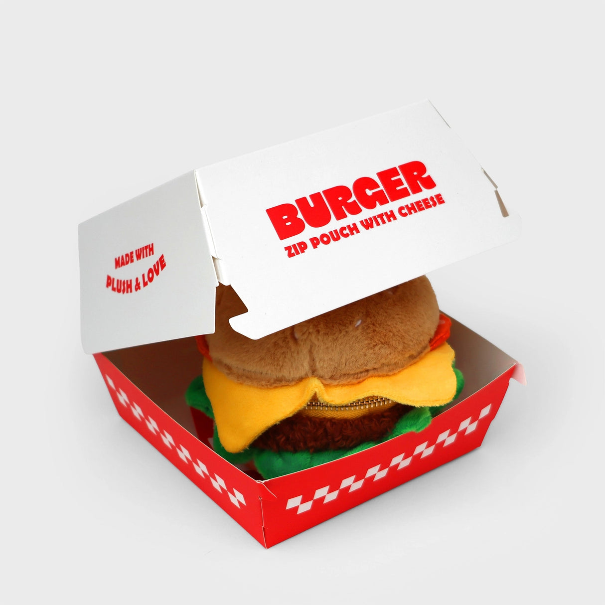 SUCK UK Plush Pouch - Hamburger
Plush burger shaped case with gold zip. Store your belongings amongst the salad and the melted cheese. Yum!
Juicy, tasty, sweet and sour. And very cute. Stuff your stuff into something soft, and squishy. Delicious looking plush zip pouches look like foodie treats but instead of calories, they hold your everyday essentials. From cheesy slices to sickly treats, each pouch is designed to be irresistible and practical. Perfect for pens, cables, cosmetics, or whatever bits and b