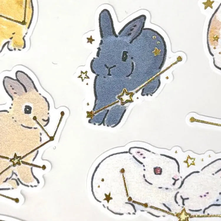 Schinako Moriyama Rabbits and Starry Sky Sticker Sheet
A sticker sheet with golden touches featuring rabbits surrounded in stars and constellations is here to add both adorable and elegant touches to your journal pages ♪