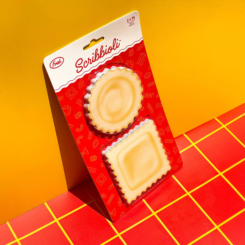 Pasta-bly the cutest sticky notes ever.
Stick a fork in your to-do list—Fred’s Scribbioli is served! These ravioli-shaped sticky notes are stuffed with charm and perfect for bite-sized reminders or saucy little love notes. Each set includes two pads with 75 sheets each and comes packed in a gift-ready backer card.