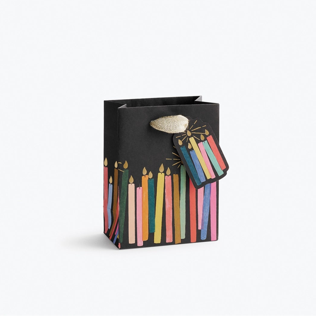 Giving gets even more special with our gift bags, which feature charming extras like gold foil accents, cotton ribbon handles, and a coordinating “To” and “From” tag.
Small: 6 x 4.5 x 0.3 in
Coated paper with cotton ribbon handles
Printed in full color and UV gold glitter
Gold lurex ribbon handles