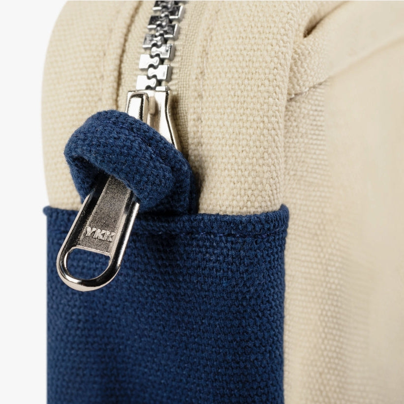 A compact carry-all pouch for artists, makers, and stationary lovers who appreciate a little order in their chaos. Structured enough to hold its form, soft enough to fit anywhere, and fully machine-washable for the days that get a little messy — your tools, pens, and creative essentials stay safe, visible, and ready wherever you go.
Inside, 20 pockets make space for art supplies, stationary essentials, and an A5 notebook, all secured by a smooth YKK zipper. Sized to fit within larger bags or carry on its o