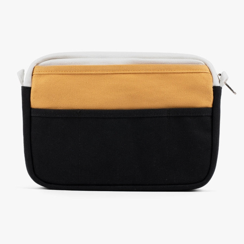 A compact carry-all pouch for artists, makers, and stationary lovers who appreciate a little order in their chaos. Structured enough to hold its form, soft enough to fit anywhere, and fully machine-washable for the days that get a little messy — your tools, pens, and creative essentials stay safe, visible, and ready wherever you go.
Inside, 20 pockets make space for art supplies, stationary essentials, and an A5 notebook, all secured by a smooth YKK zipper. Sized to fit within larger bags or carry on its o