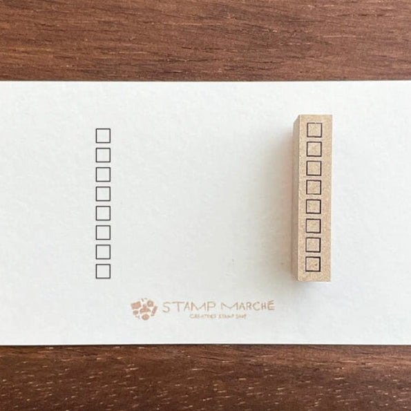Stamp Marche Planner Check Box Wooden Stamp - Squares
Add a touch of charm to your daily planning with this beautifully crafted wooden stamp from Stamp Marche. Designed for journals, planners, and memos, this stamp is perfect for filling small spaces with neat checkboxes. It’s ideal for marking tasks, tracking habits, or adding a sweet decorative accent to any page. Made in Japan with high‑quality wood and rubber, it delivers crisp impressions and a delightful handmade feel.
Stamp size: approx. 27 mm
