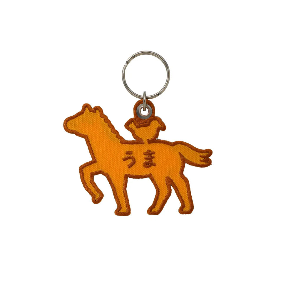 An embroidery keychain featuring the Horse which is the seventh sign of the Chinese zodiac. The horse symbolizes vitality and bold changes. Get lucky to use it as a keychain and a tag for your planner. LNY is February 17th this year!
A little bird perched atop on the brown horse adds a charming accent. The back side is embroidered with the word "uma" in hiragana, meaning a horse in Japanese. 