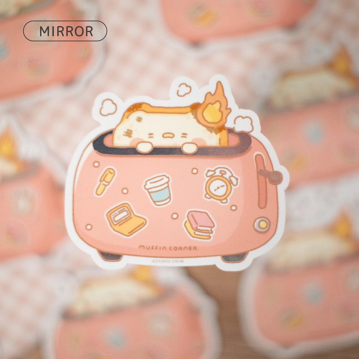 A sticker of burnt Muffinmaru toast feeling burnt out first thing in the morning. This sticker has a shiny mirror-like finish on some parts of the toaster for some extra flare. This durable sticker is great for decorating water bottles, laptops, suitcases, and much more!
Dimensions: 2.8" x 2.5" (7.1cm x 6.4cm)
Material: PET
Waterproof
Quantity: 1 sticker